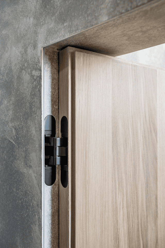 Close-up of concealed hidden door edge and minimal hardware detail